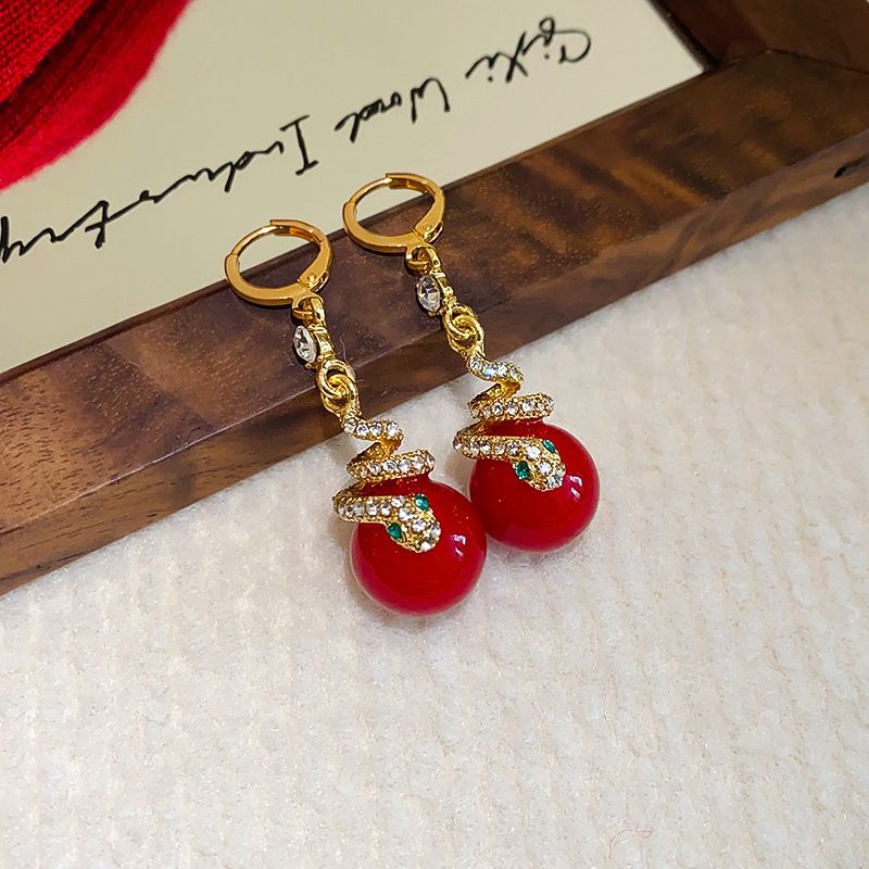 🐍Specjalna oferta noworoczna🎀 Kolczyki z pozłacanej perły w kształcie węża